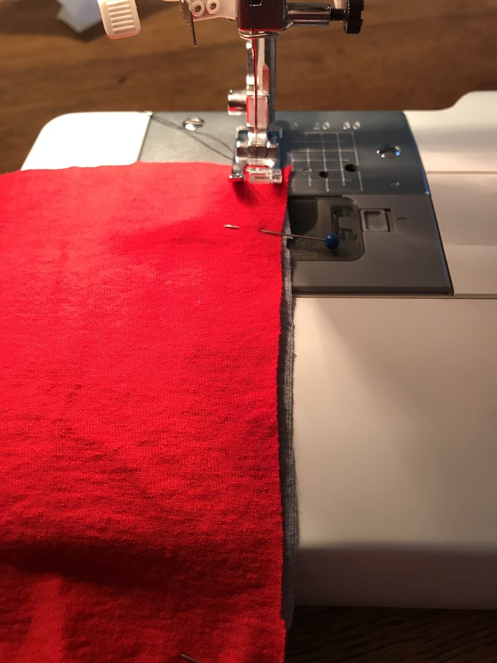 Stitch the edge at 3/8" by lining up the edge of the shirts with the right edge of the pressed foot. Don't forget to backstitch at the top and bottom of the seam.