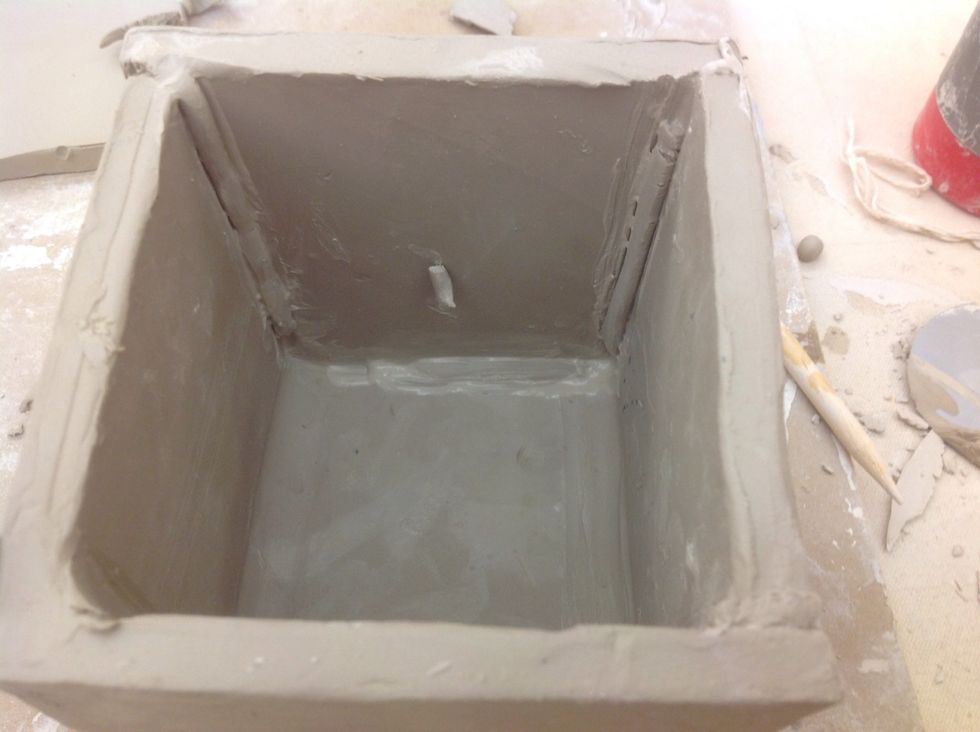 Stitch the pieces together and smooth in a coil.