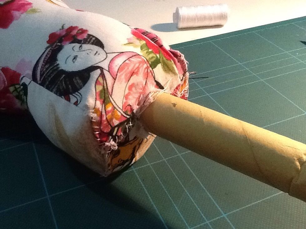 Stitch the sides of the fabric around the roll to secure it. The roll I used was an inch in diameter.