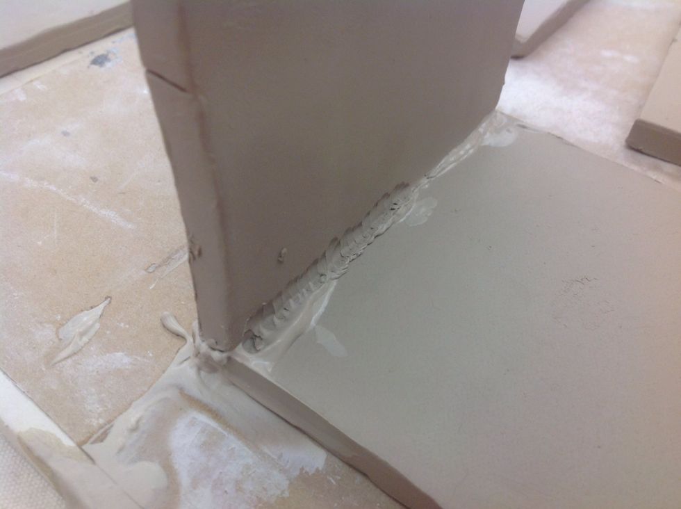 Stitch the two pieces together with a wood tool.