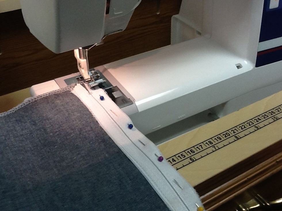 Stitch using a 2.5 stitch length. As your guideline run the left side of the zipper next to the right edge of the zipper teeth.