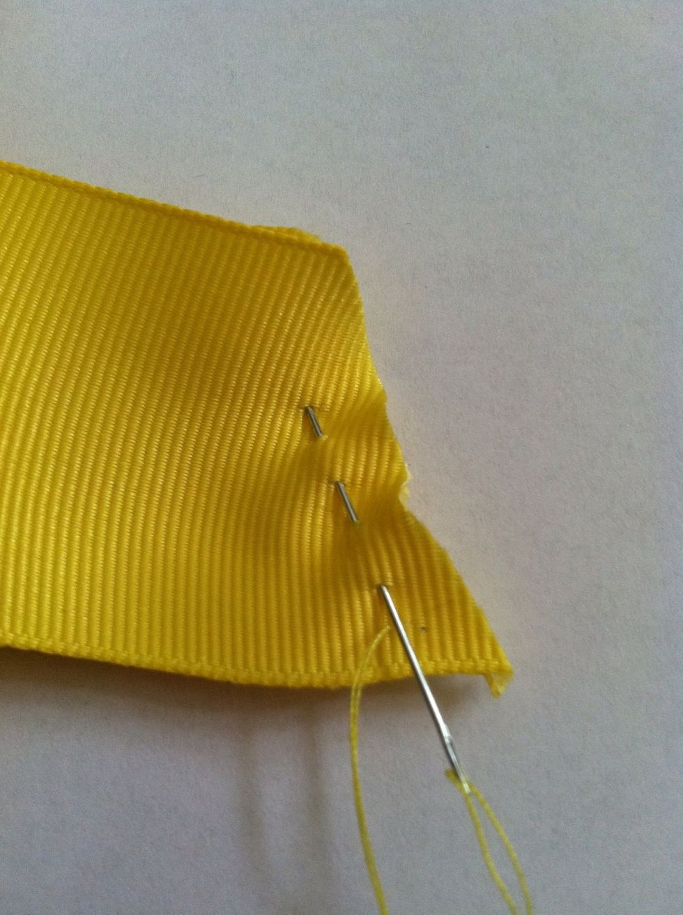 Stitch your way along to short side, using a running stitch. Simply go through the front side and back through the back side, repeat.