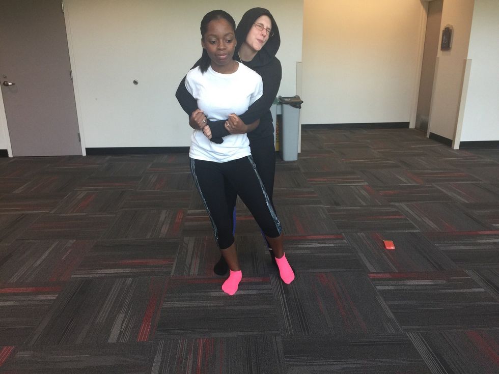 Stomp the assailant's foot *Do not drop your weight and stomp their foot at the same time. this will cause you to lose your balance.*