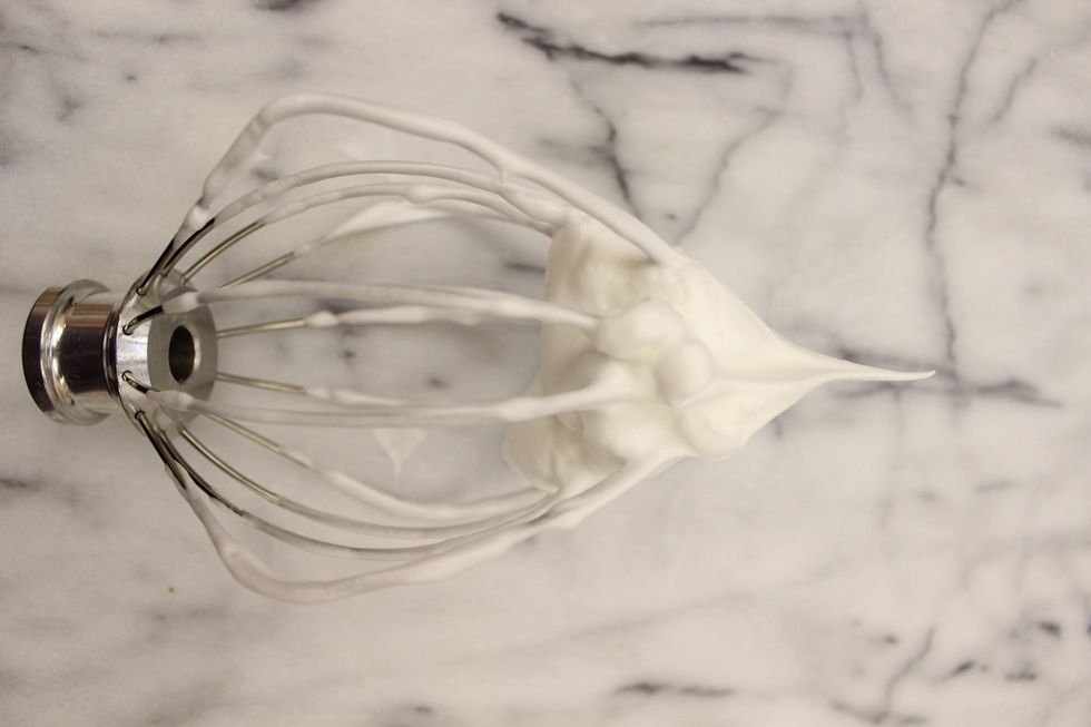 Stop beating the meringue when you've reached a stiff/non-drooping peak.