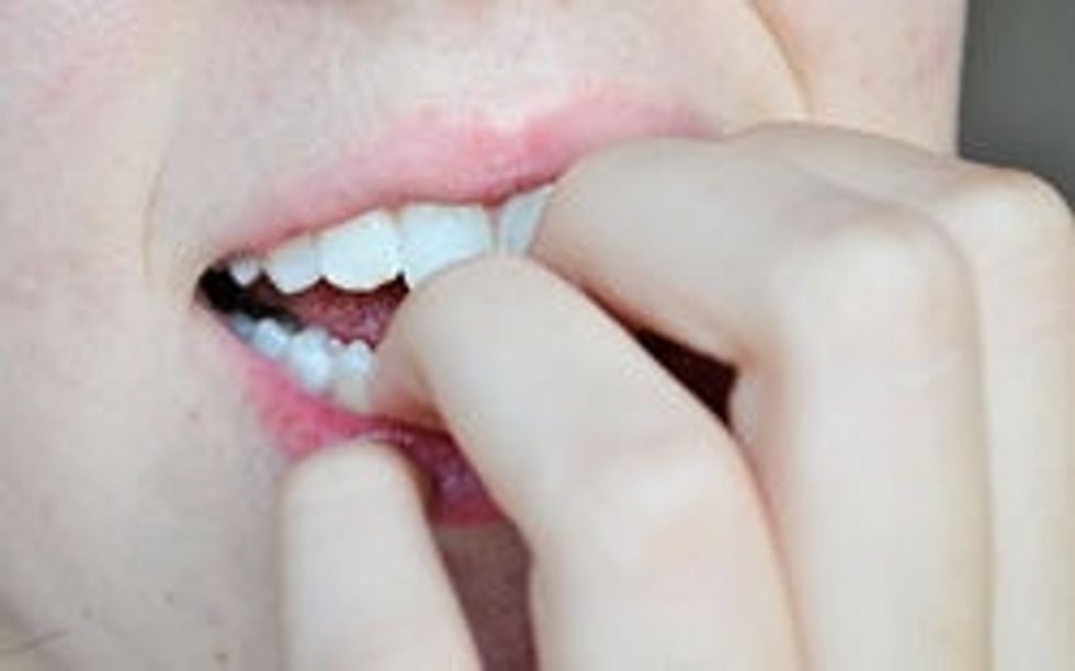 Stop biting them. Yes.. it's pretty hard. But they have some bitter tasting polishes on the market. The only thing is, they may have to be re-applied every few days for the bitter taste to stay.