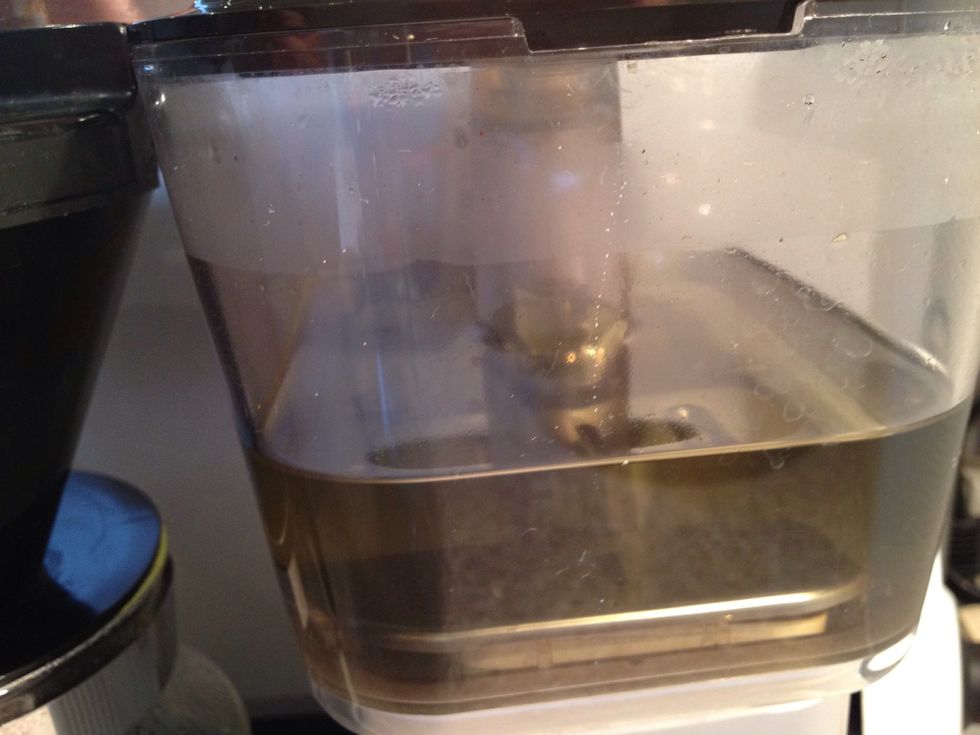 Stop when half of the vinegar have run through. Let it sit for 20 mins or so. This to rinse the inside of the machine. Turn power back on and let all the vinegar run through.