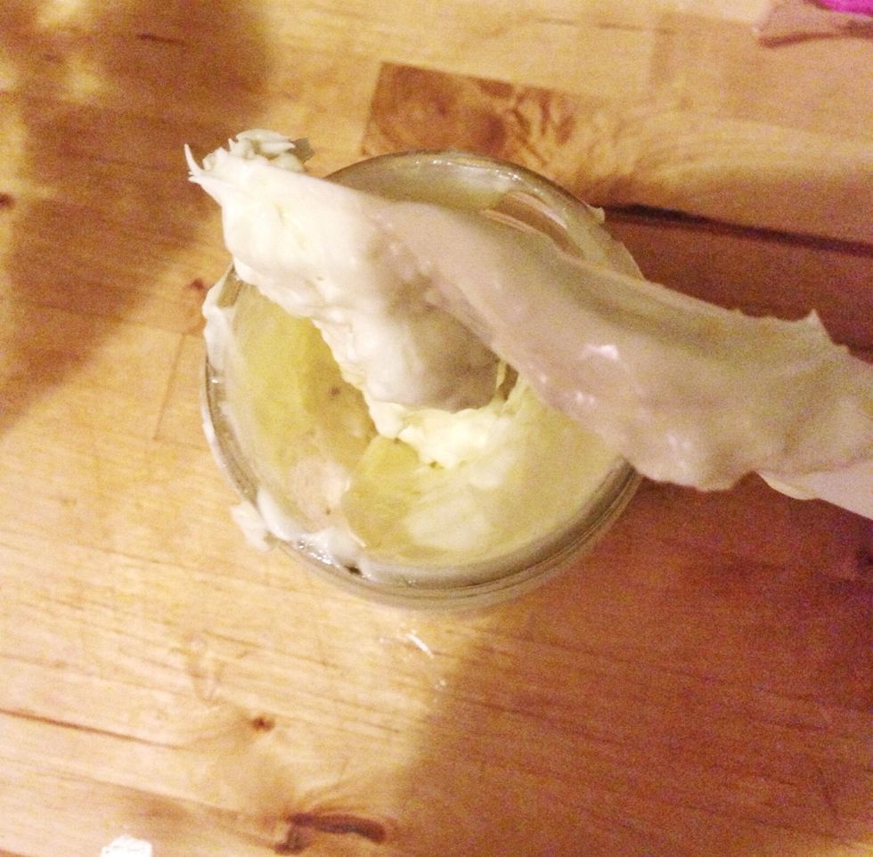 Store in a glass jar. If your home is on the warmer side it may need to be stored in the fridge if not it'll stay at a nice whipped consistency.