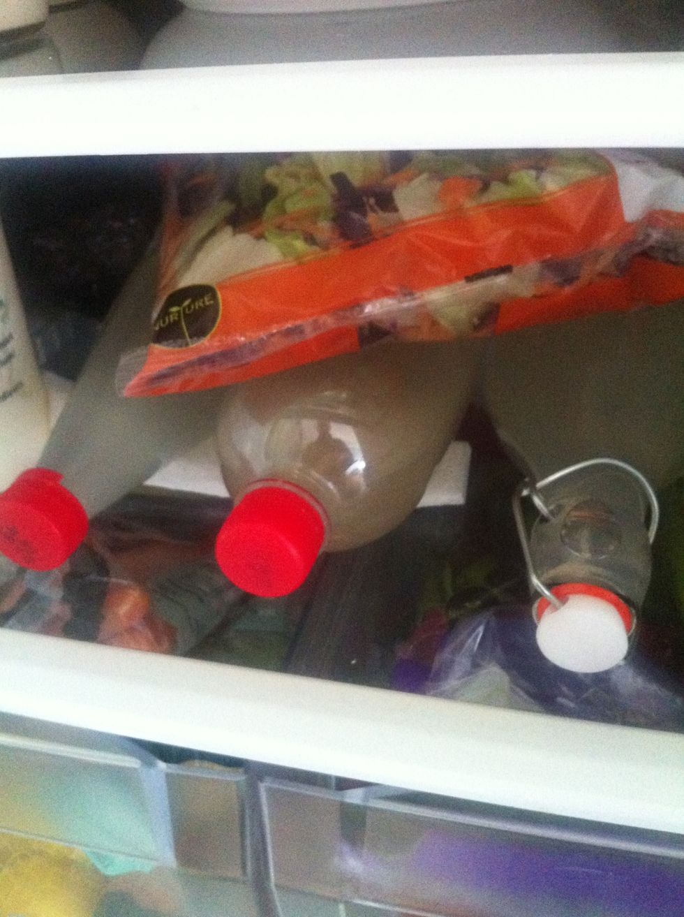 Store in fridge - a larger fridge means you could store upright, however we lie them down due to space limitations in our shoe box of a dwelling!