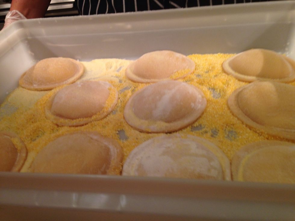 Store on the refrigerator, use semolina flour to keep from sticking together. When you are ready to serve it boil for 2 mins or until the ravioli floats to the top.
