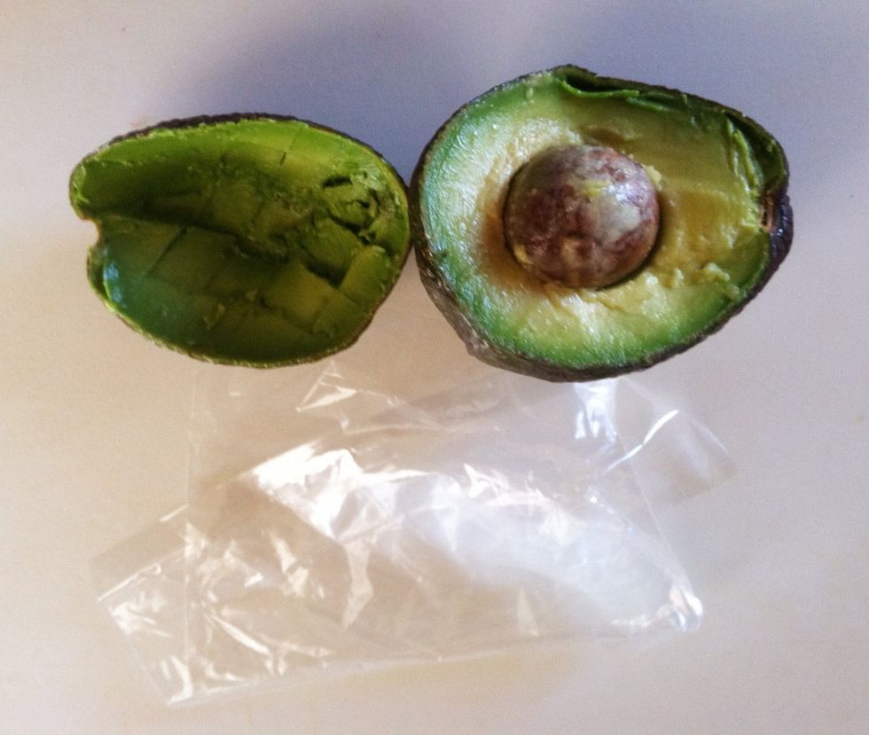 Store the avocado in two sandwich bags. Use the bags that do not have a ziplock.