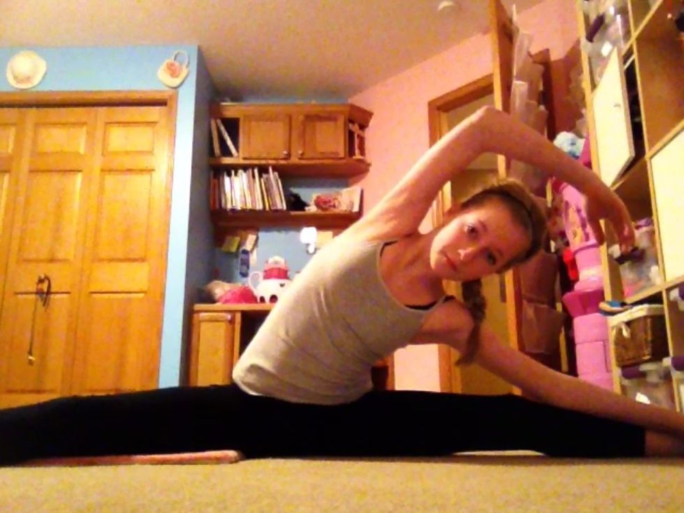 Straddle stretch: sit in straddle and lean to one side, then the other. Don't forget to point your toes!