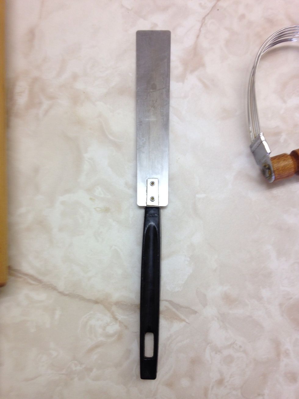 Straight Edge Spatula  Used to level flour and get butter out of measuring cups  I can use a straight edge spatula to level off the flour