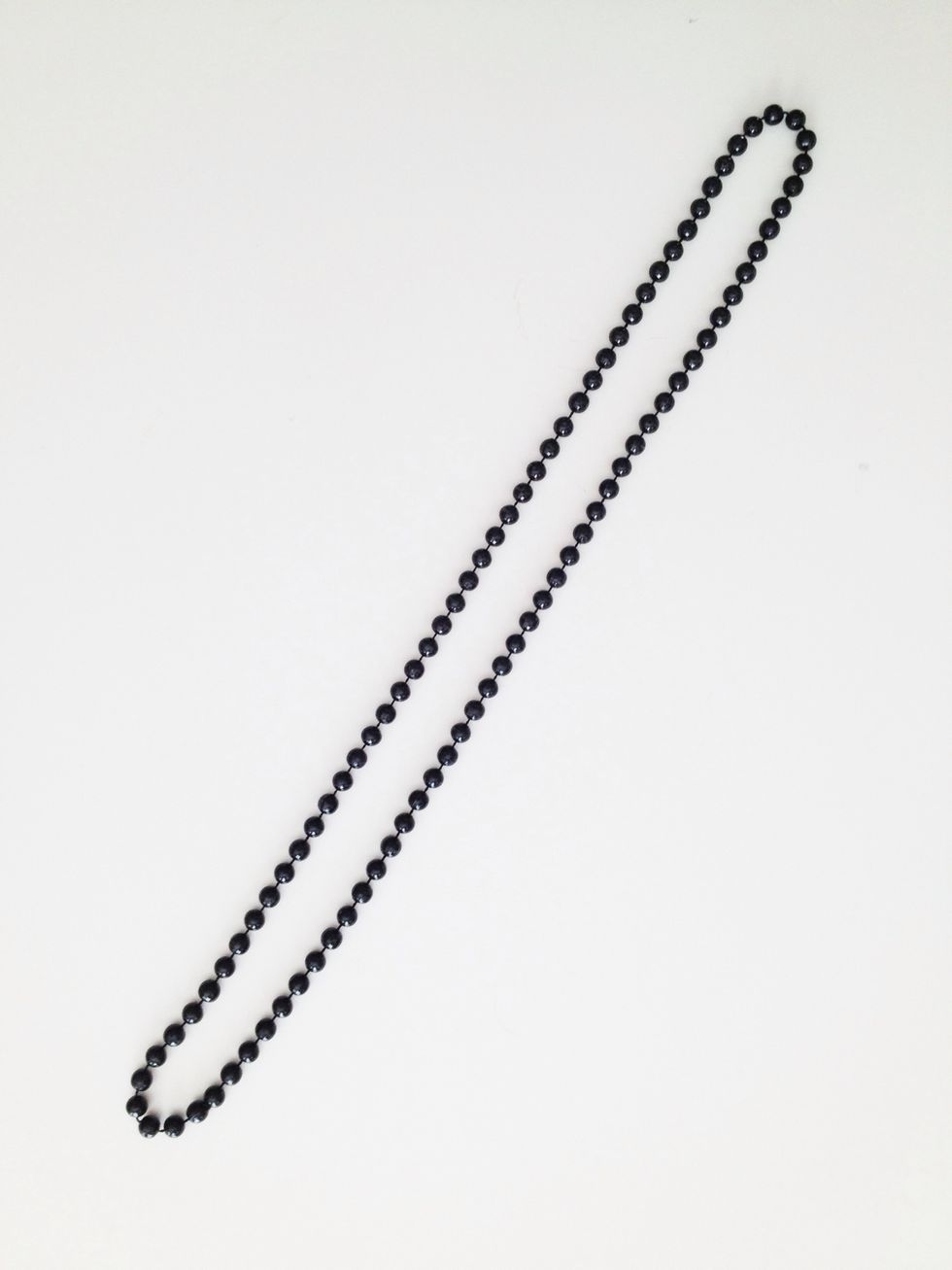 Straighten out your necklace and lay it flat.