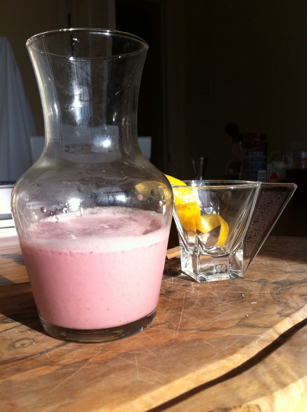 Strain into a small carafe and make a lemon twist to garnish