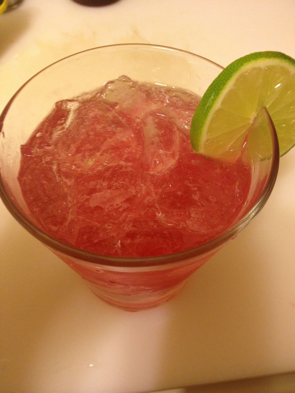 Strain into a tumbler with ice. Garnsh with your choice of mint and lime.