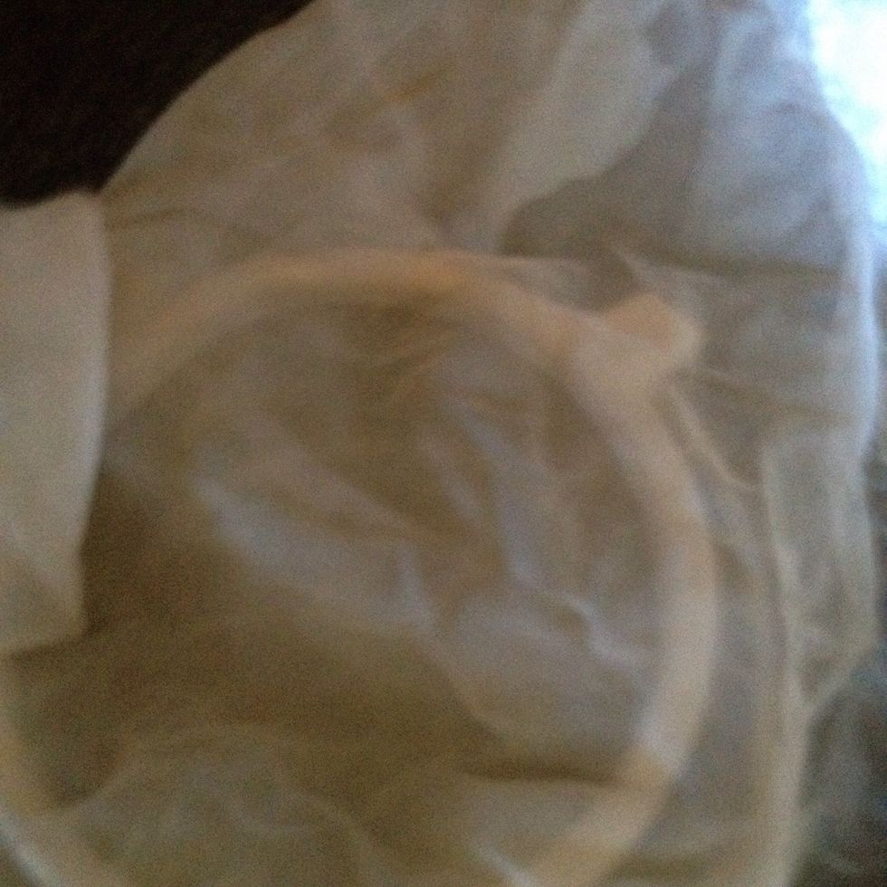 Strain it in a cloth like this