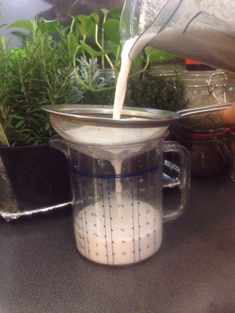 Strain milk. A muslin cloth or nut milk bag can also be used.