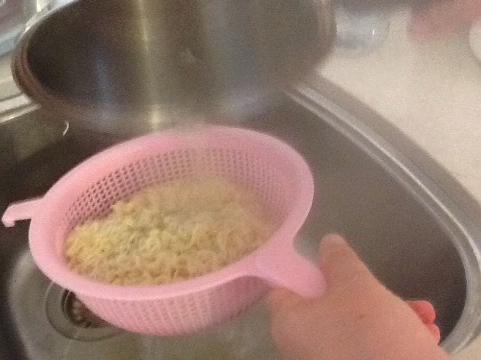 Strain noodles using a strainer