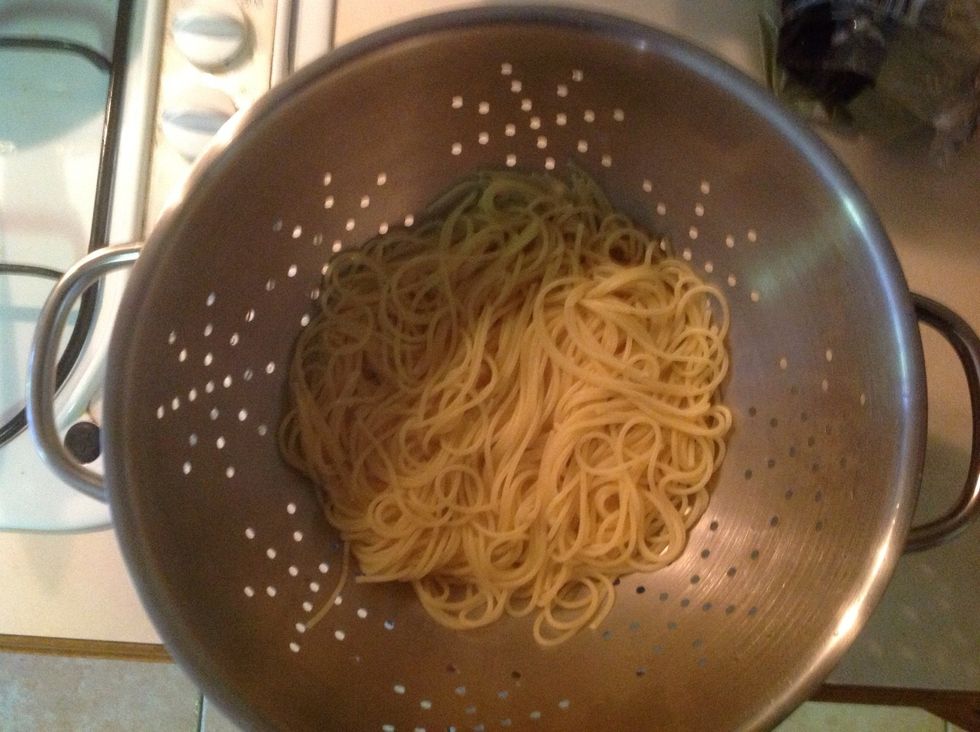 Strain pasta and serve in two bowls