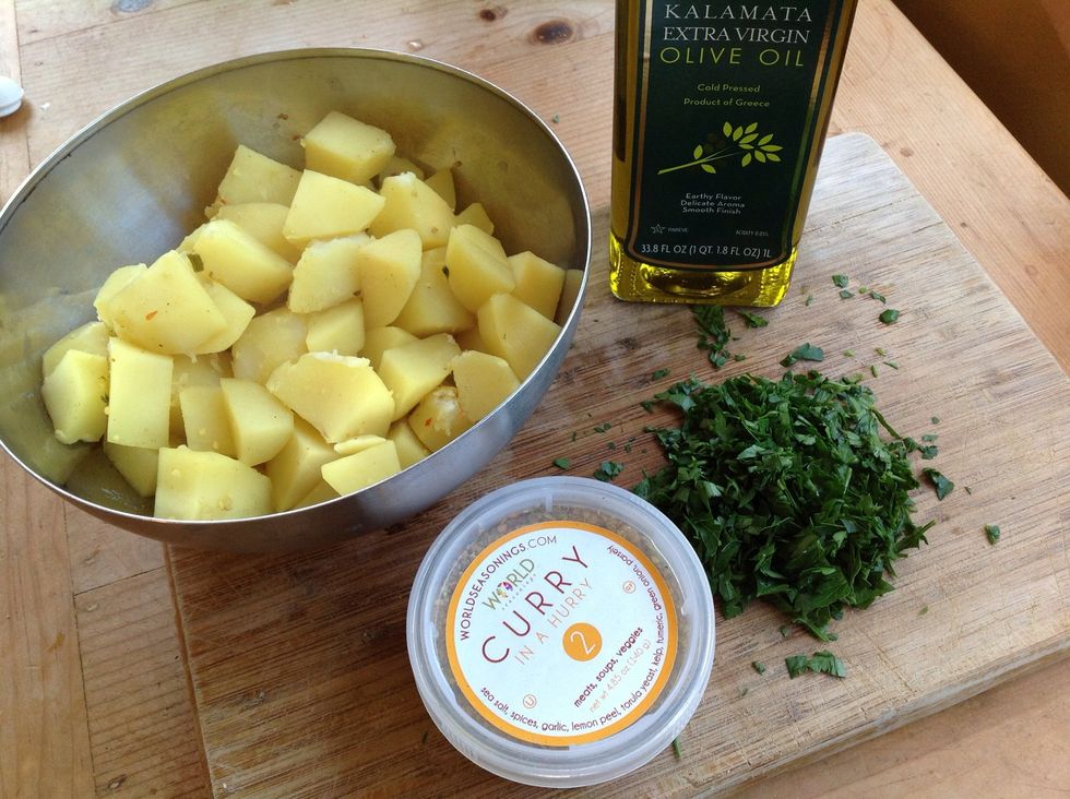 Strain potatoes then place in bowl to cool a bit. Add remaining 3/4 teaspoons #2 Curry in a Hurry, olive oil and parsley.