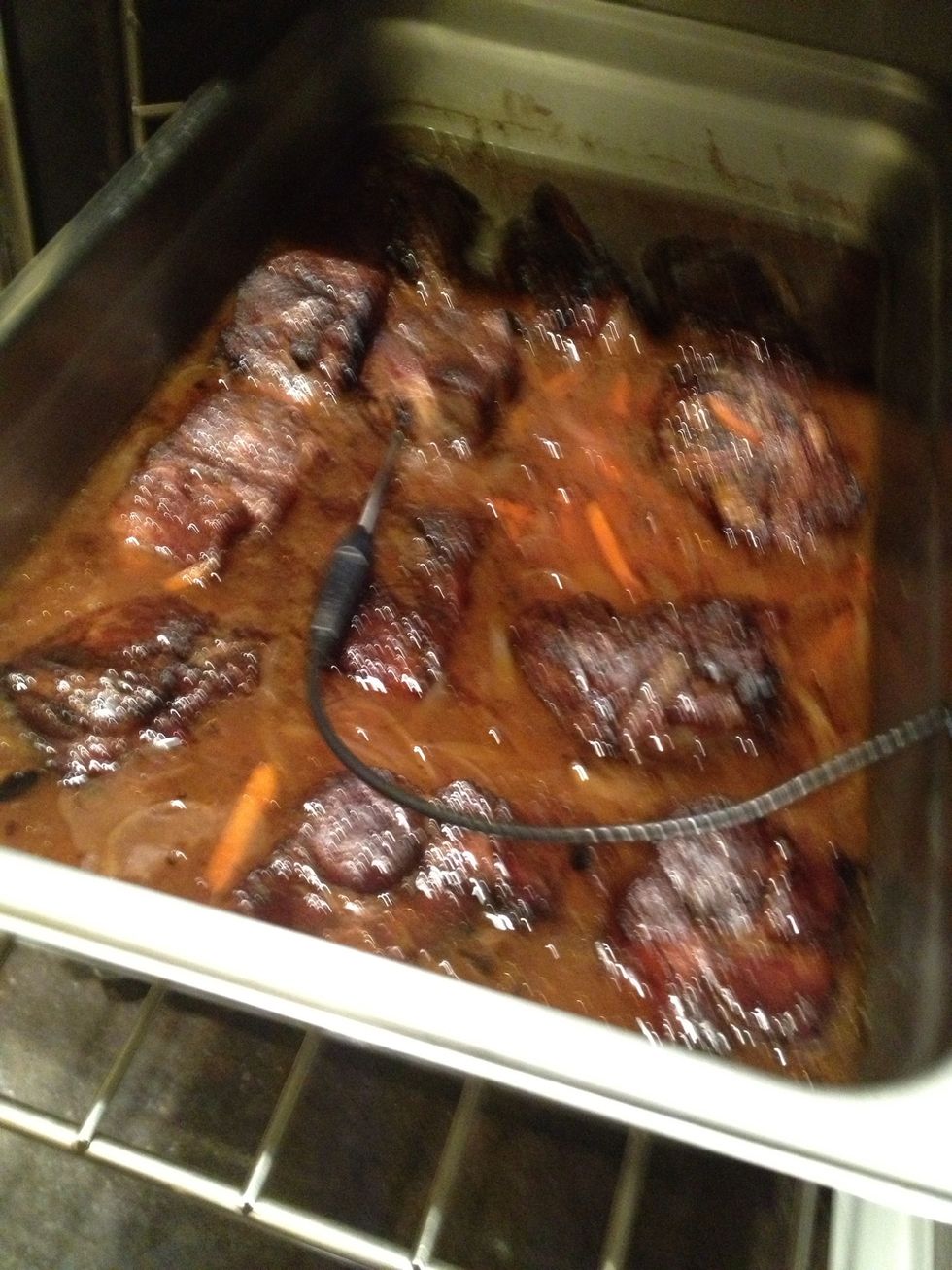 Strain the braising liquid off the meat and reduce