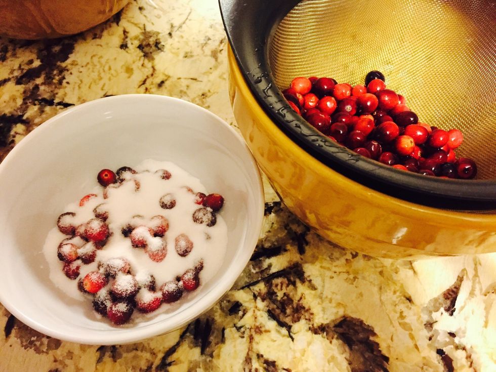 Strain the cranberries from the previous night and in small batches, roll them in sugar. Set aside for the topping.