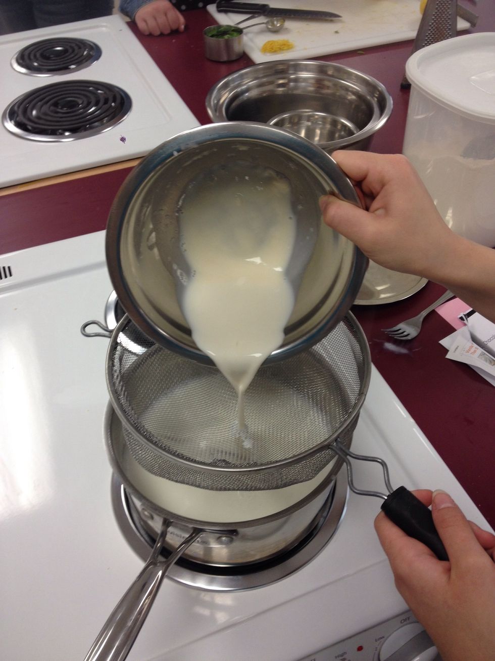 Strain the flour mixture into the saucepan