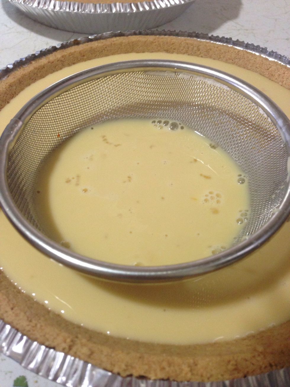 Strain the mixture to the tart shell.