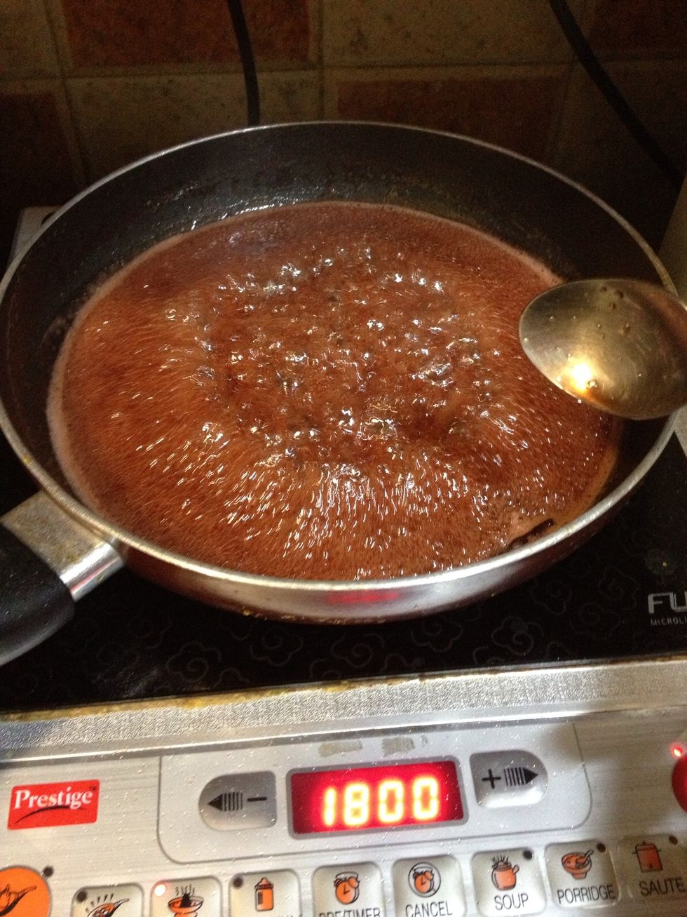 Strain the pears out and take the syrup and reduce in a flat pan to make it thicker.