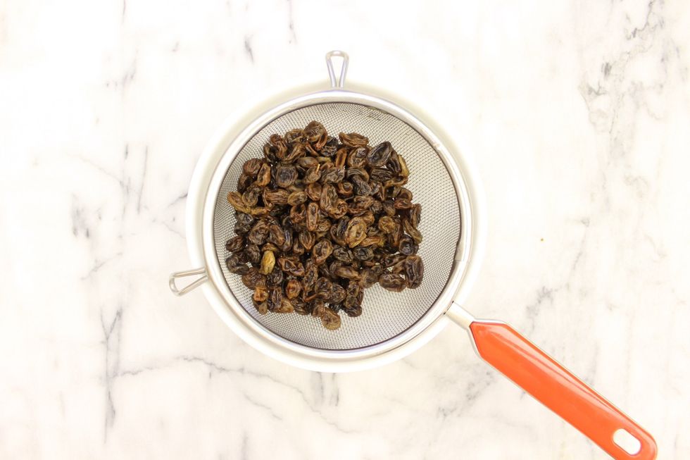 Strain the raisins. Set aside.