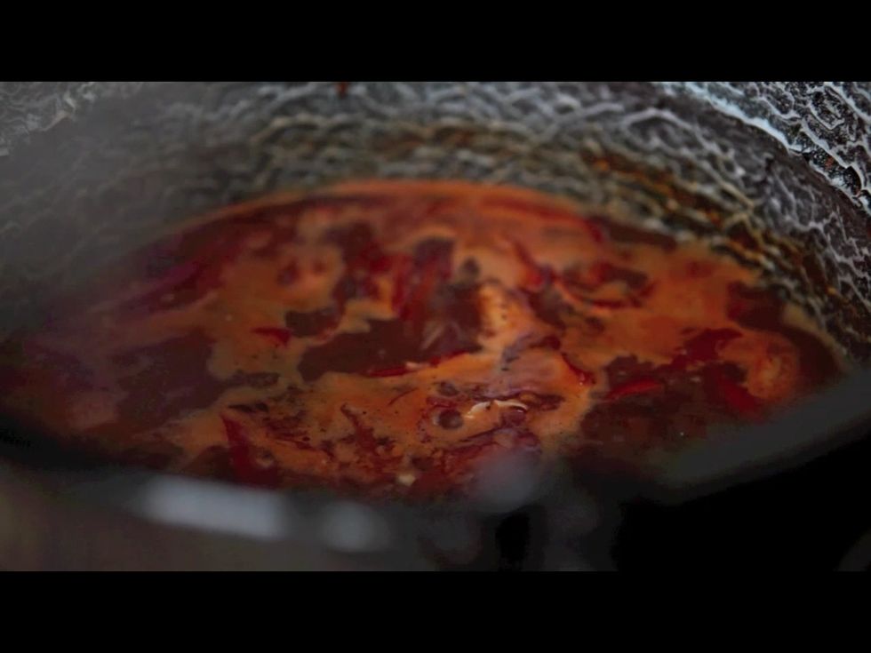 Strain the stock. Grate the onion through a sieve and return it to the stock.