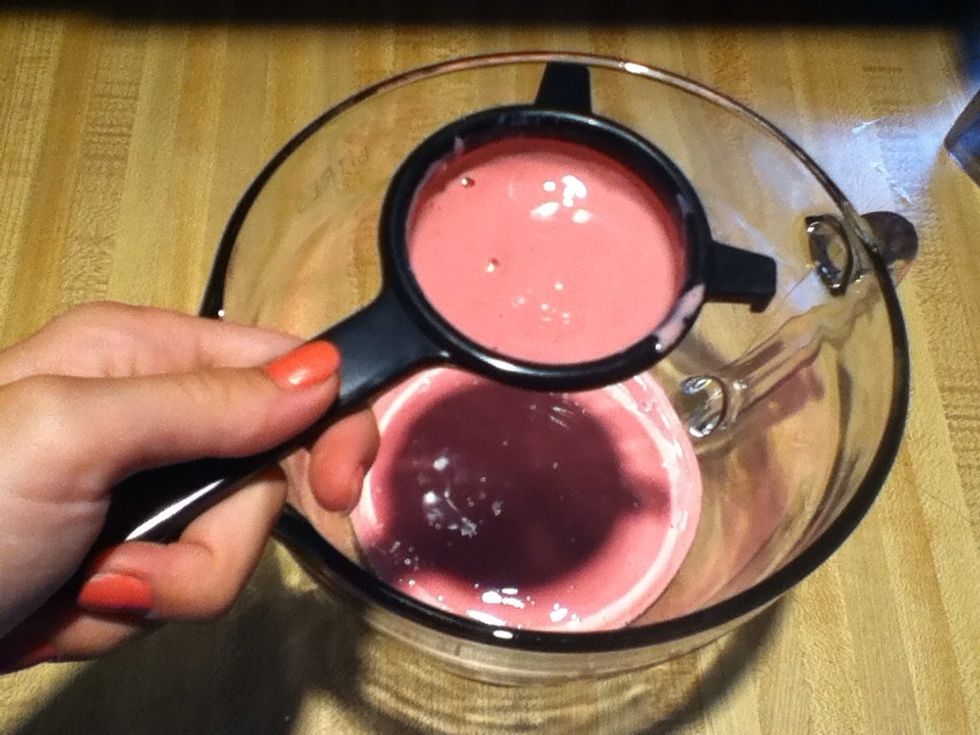 Strain the yogurt mixture. You may not get rid of all of the raspberry seeds, but it will will remove the bulk of them.