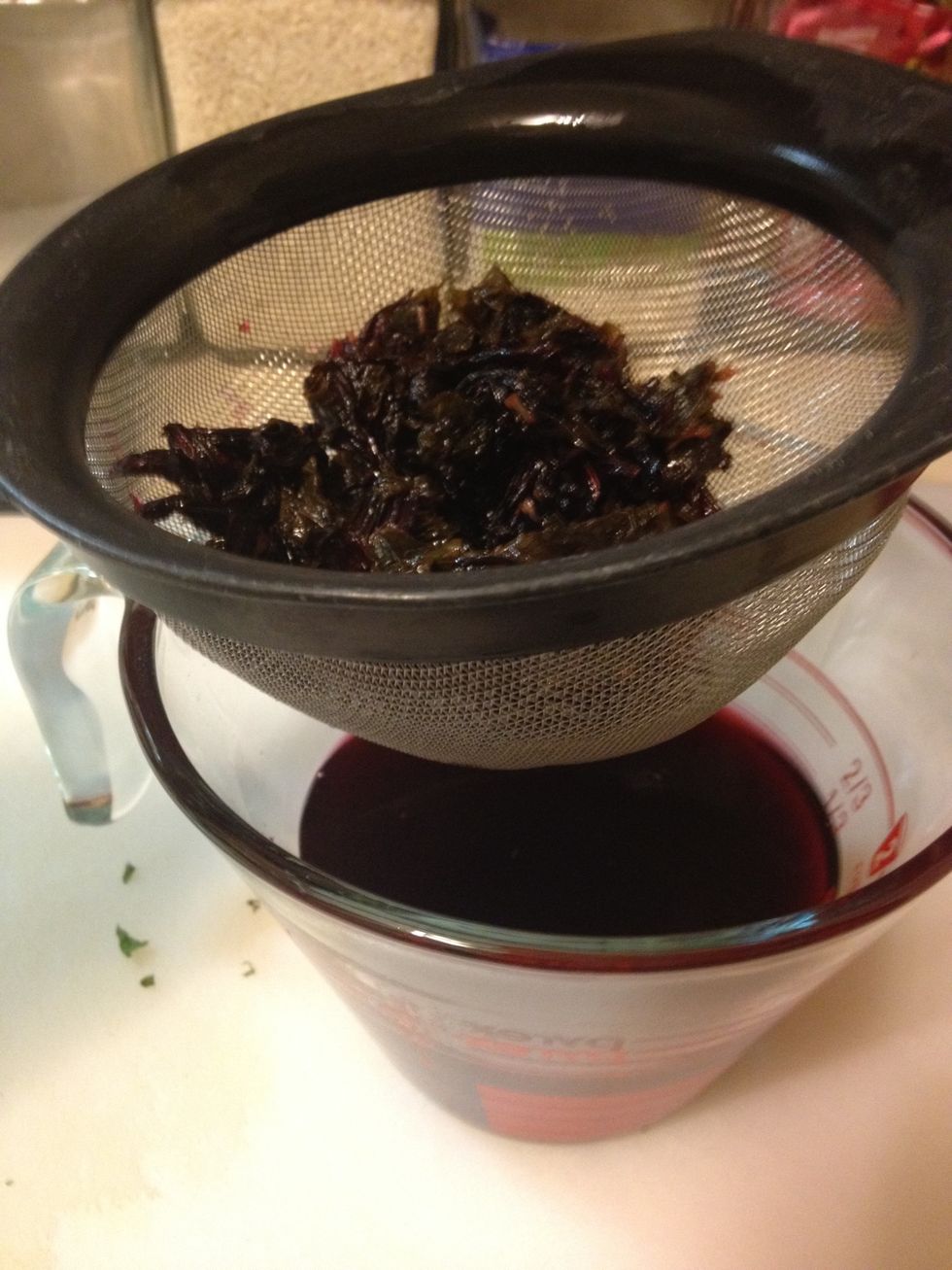 Strain through a fine mesh sieve. Press the solids to extraxt syrup. If small solids remain strain again. Should make about a 1 1/2 cups.