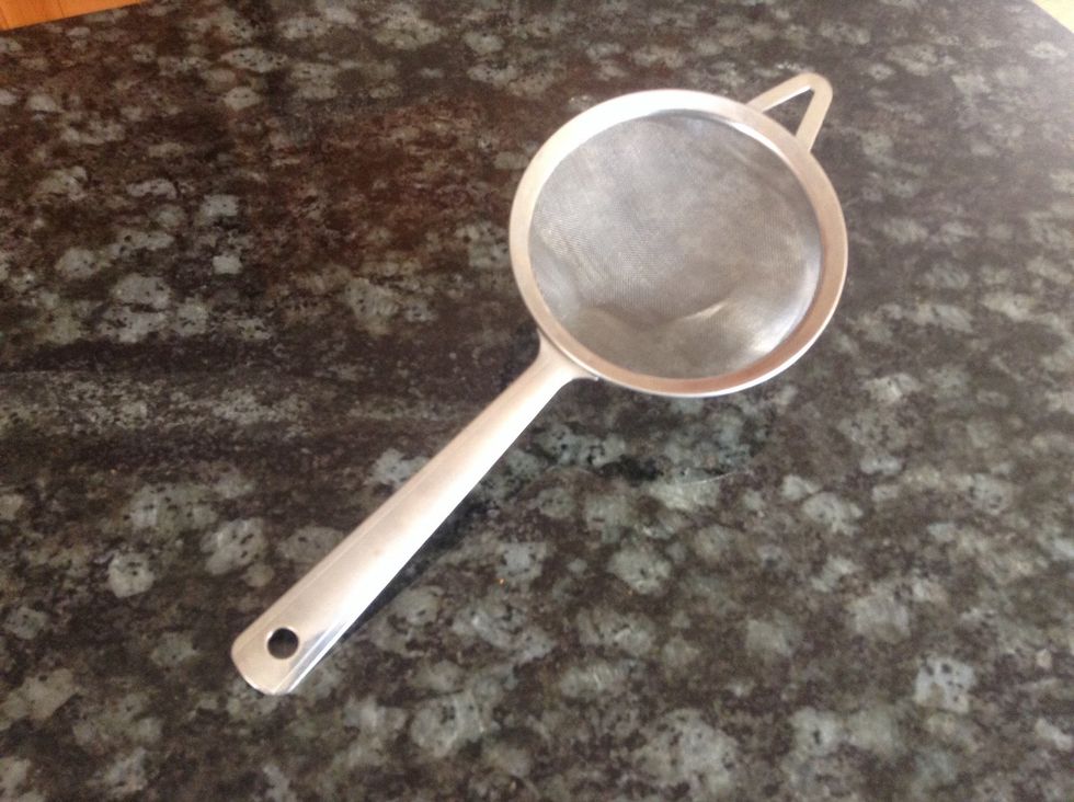 Strainer. Used to sprinkle powders onto food. I can use a strainer to sprinkle powdered sugar on cookies. Working on this tedious assignment puts a "strain" on my patience. :P