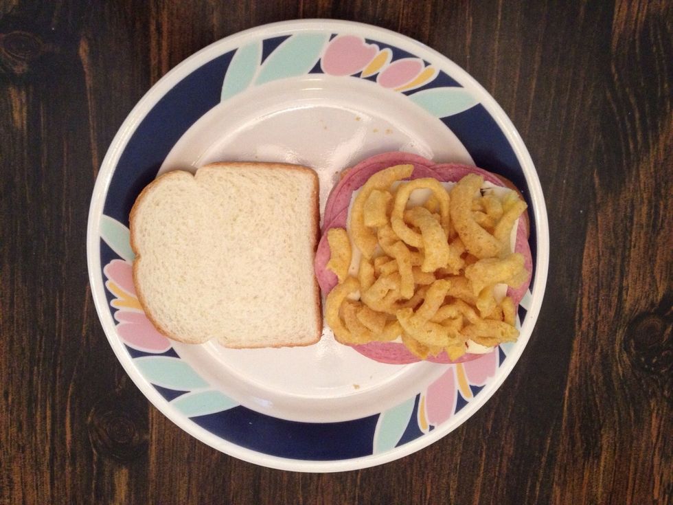 Strategically place a couple handfuls of Funyuns (depending how big your banana-hands are) onto the pepper jack cheese...