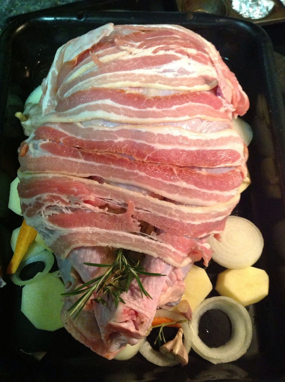 Streaky bacon not only looks good but it protects the breast and keeps it moist. I also add some of the bacon to the gravy.