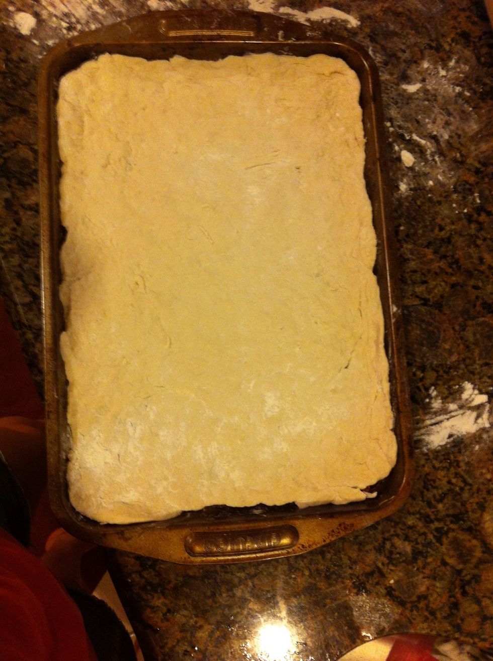 Stretch dough into a oven safe pan.