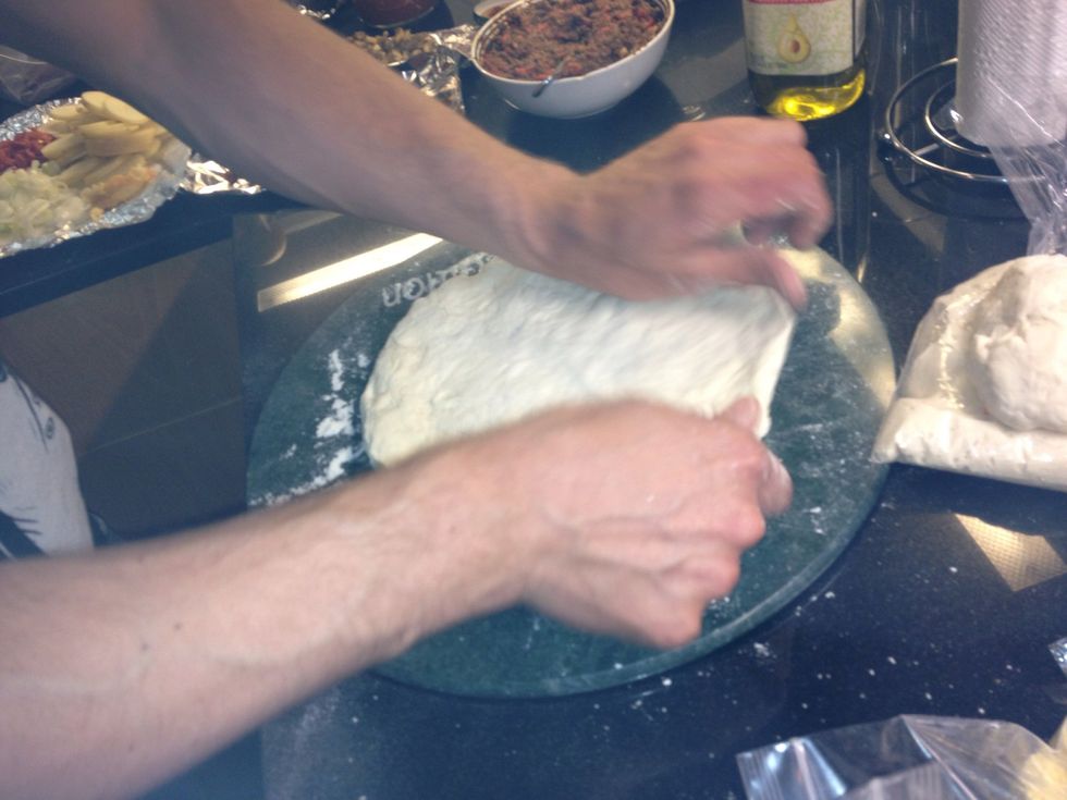 Stretch dough out to 1/4" thickness don't overwork!  Drizzle dough with olive oil and bake for 10 minutes remove & cool for 10 minutes before proceeding