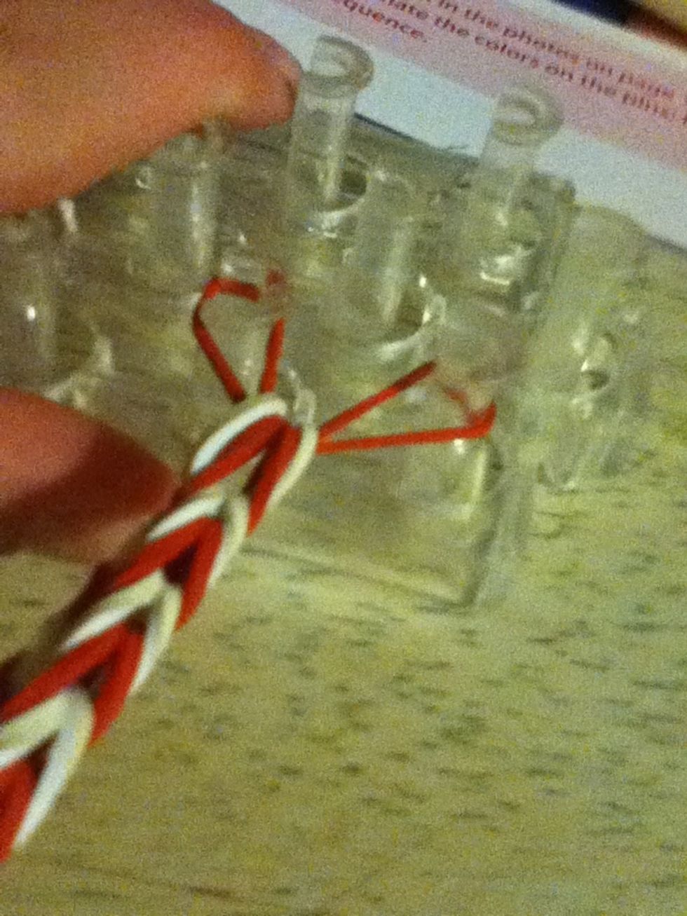 Stretch it out and pull bracelet off on to your fingers unless you are using fingers to do this