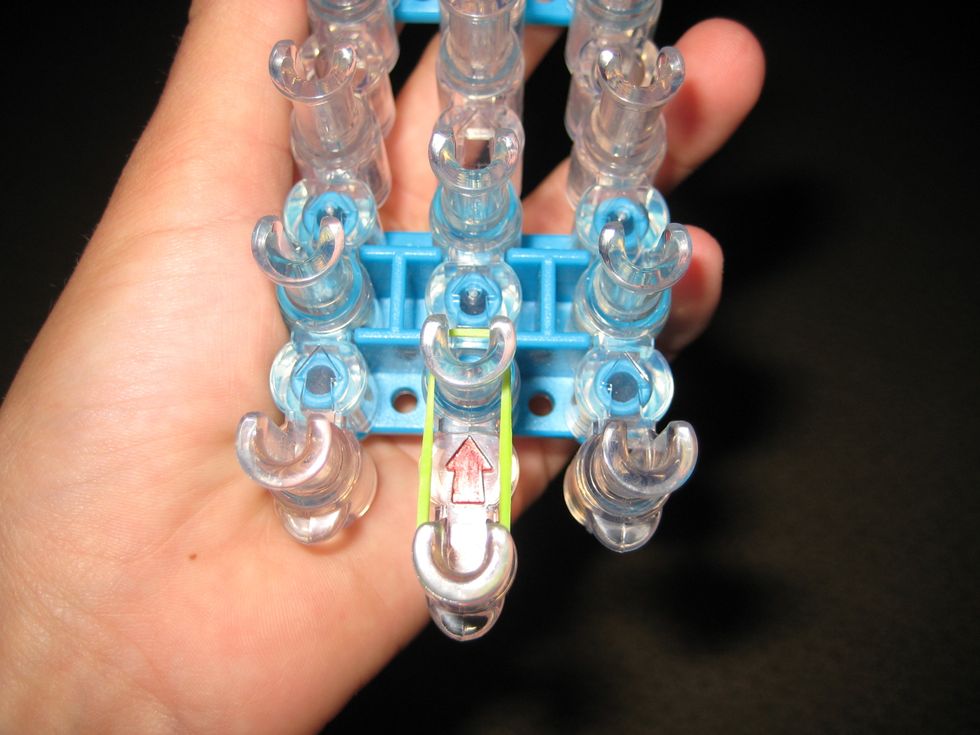 Stretch one band from bottom to the next one up. Push it down.