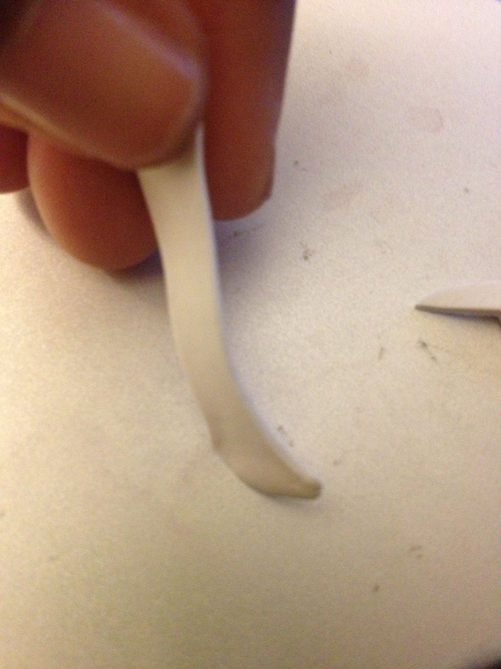 Stretch out the piece so it's longer like an actual piece of tape.
