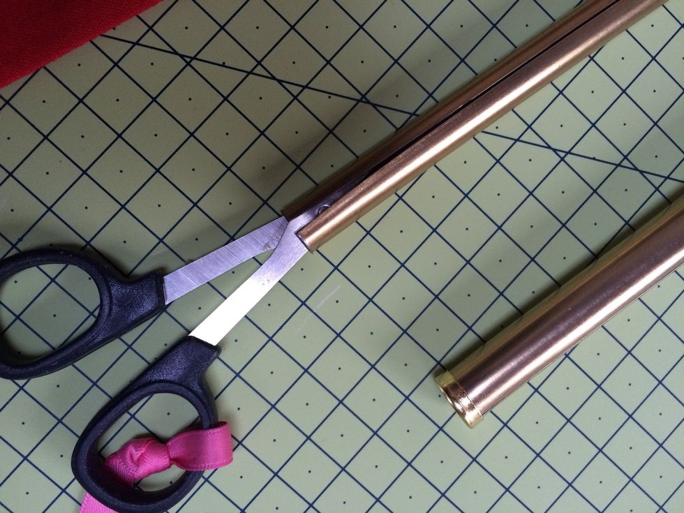 Stretch the opening of the narrower cafe rod . This prevents the extendable rod from sliding in on itself.