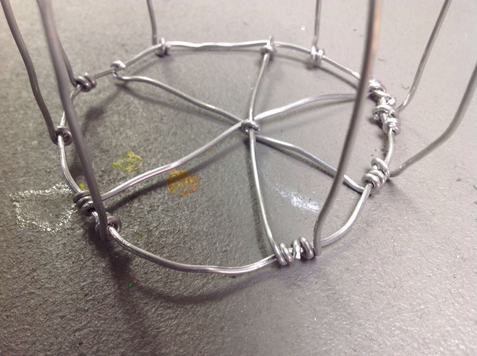 Stretch them across the circle and attach.