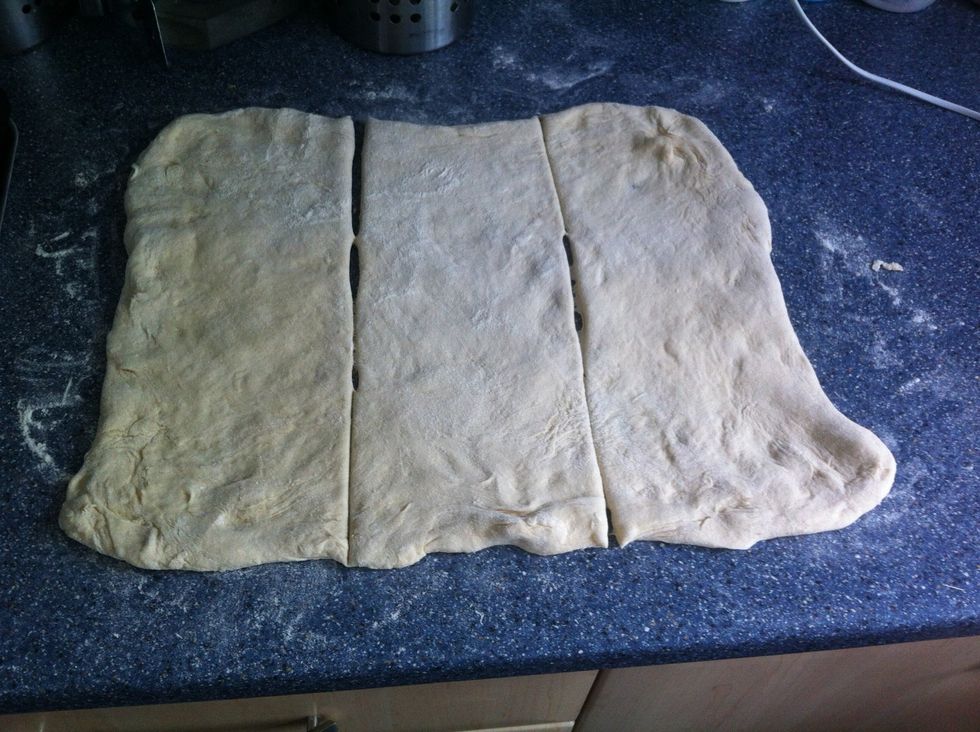 Stretched out and cut to equal sizes.