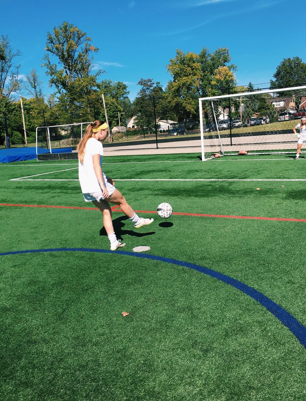 Strike the ball with your laces, or the top of your foot.