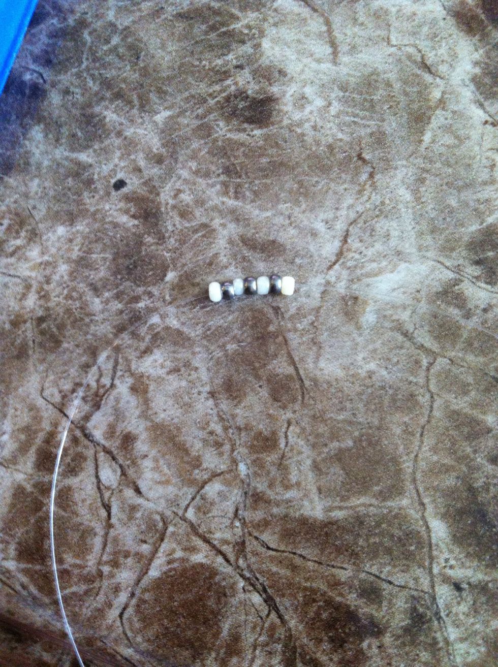 String 7 beads on, in a white/silver/white/silver pattern