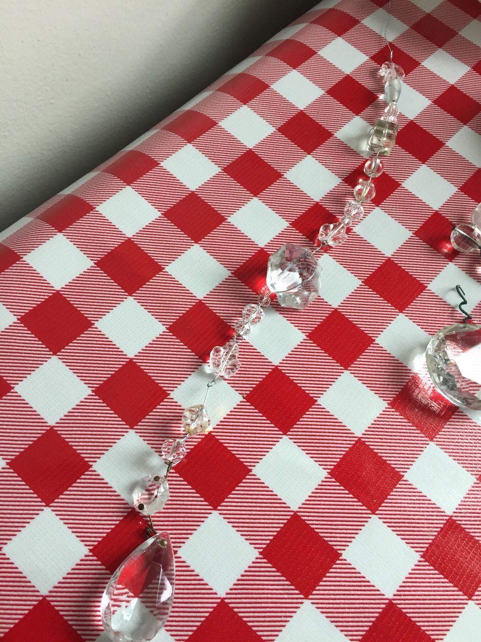 String beads on wire in any pattern you\u2019d like. You can put a little knot between a section of beads to divide up, or make one solid line of beads.