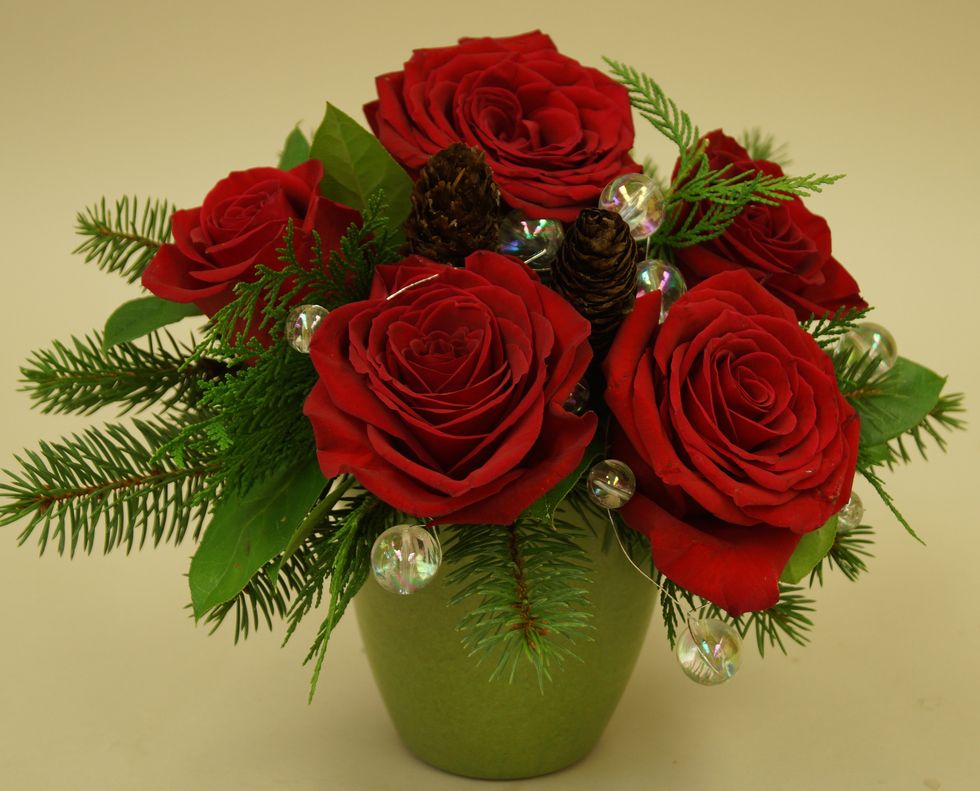 String OASIS\u2122 Mega Beaded Wire into arrangement to complete the design.