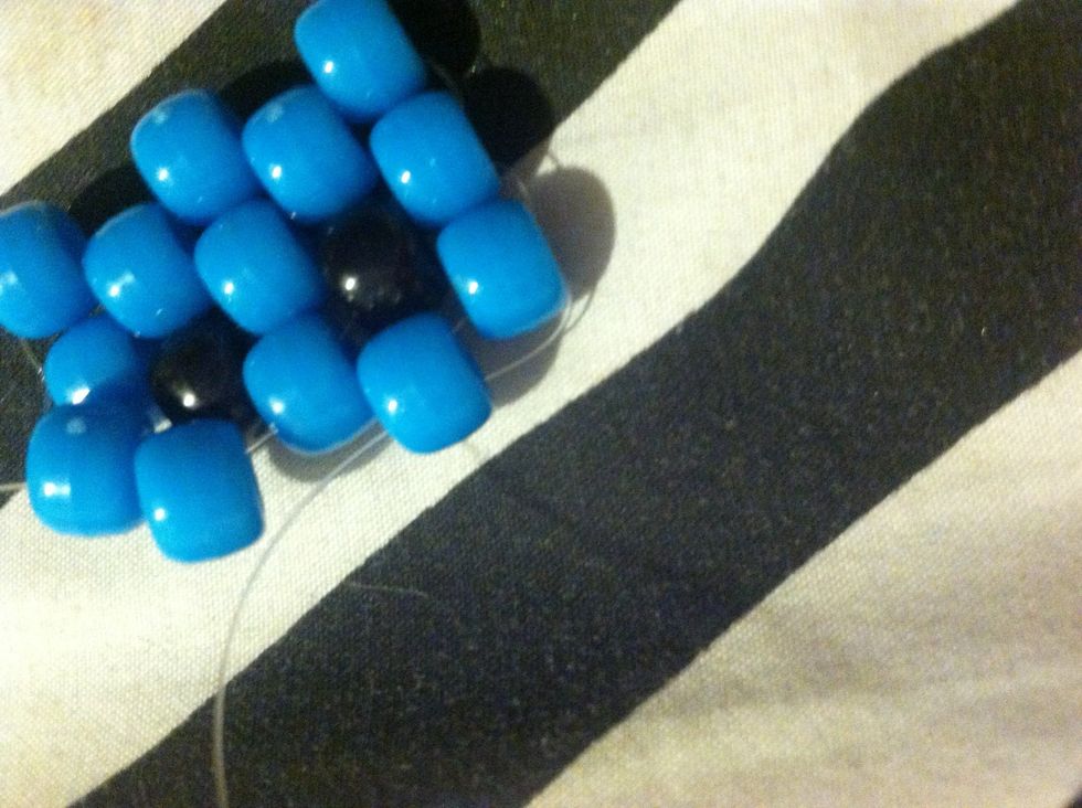 String Up Through Your Last Top Blue Bead and Add A Blue Bead And String It Through .