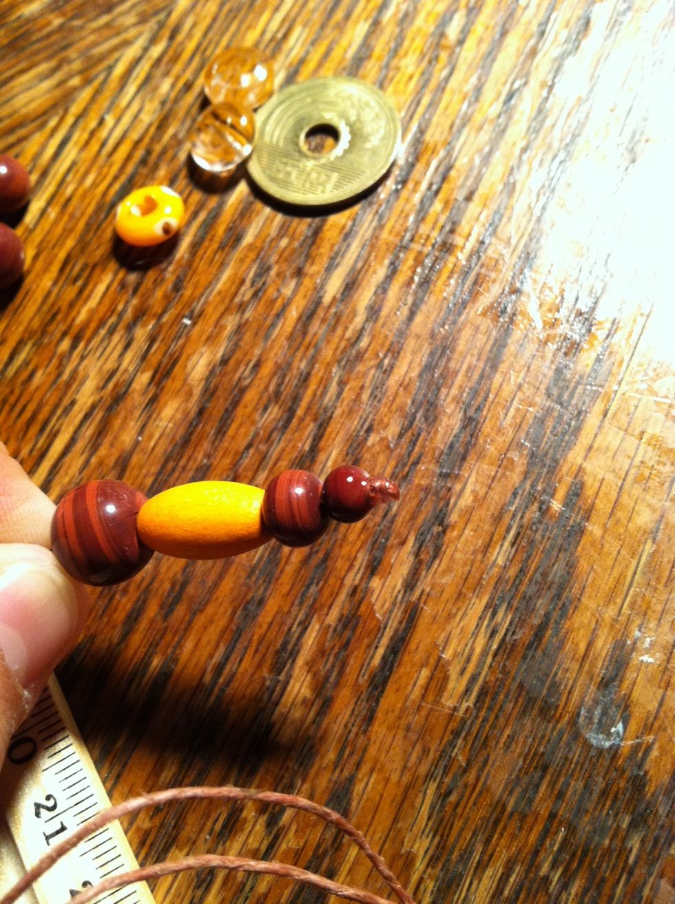 String your beads, tie a knot where you want it to end. Snip it and put a dab of glue. I've mentioned that I use fabric glue, I also like to glue the knot to the last bead for a stronger hold.